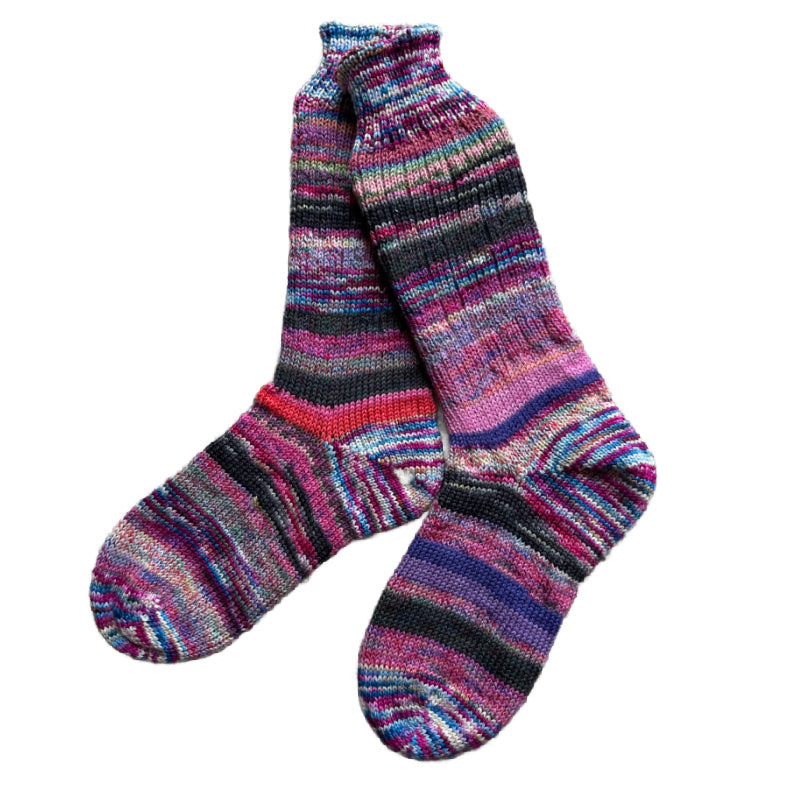 Artisan wool socks in vibrant colors, handknit for warmth.