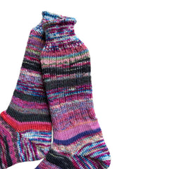 Artisan wool socks in vibrant colors, handknit for warmth.