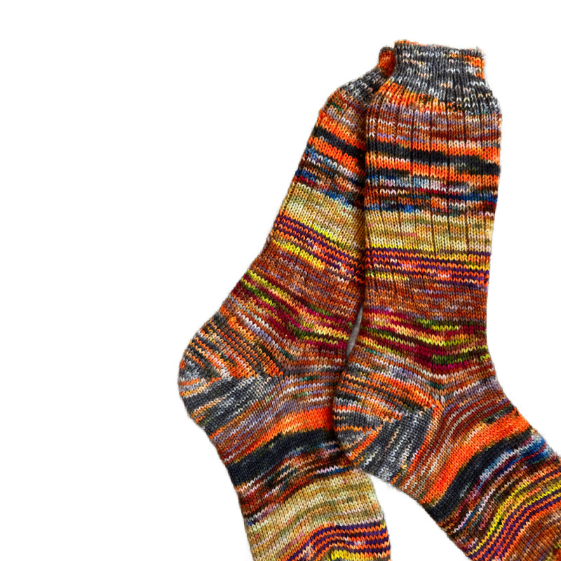 Scrappy wool socks in vibrant colors, perfect for winter.