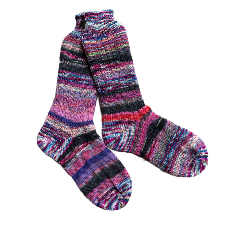 Artisan wool socks in vibrant colors, handknit for warmth.