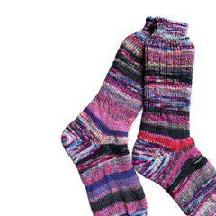 Artisan wool socks in vibrant colors, hand-knit for warmth.