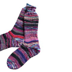 Artisan wool socks in vibrant colors, handknit for warmth.